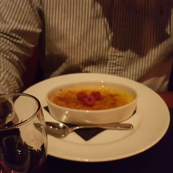 J. Gilbert's Wood-Fired Steaks & Seafood - Vanilla bean creme brulee with seasonal berries. - Steakhouses Near Me - Overland Park, Kansas J. Gilbert's Wood-Fired Steaks & Seafood - Vanilla bean creme brulee with seasonal berries. - Steakhouses Near Me - Overland Park, Kansas