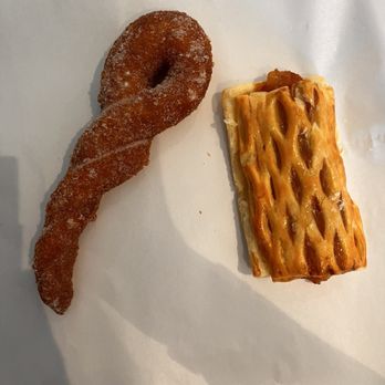 Paris Baguette - Twisted donut and an apple pie pastry (so tender that I dropped it with the tongs). - Bakeries Near Me - Aurora, Colorado Paris Baguette - Twisted donut and an apple pie pastry (so tender that I dropped it with the tongs). - Bakeries Near Me - Aurora, Colorado