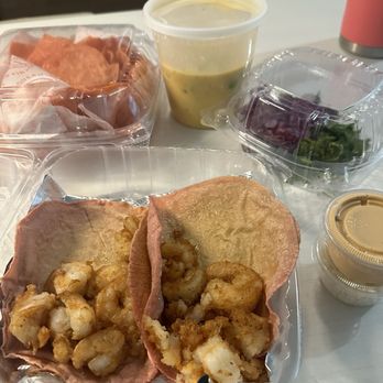 Taquero Mucho - Fried shrimp tacos to go so requested everything on the side. The chips are amazing. - Tacos Near Me - Austin, Texas