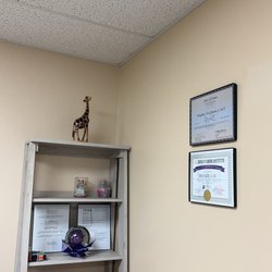 Sun Reflexology & Spa - Corner by front desk with certificates