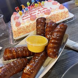 a plate of pretzels and a birthday cake a plate of pretzels and a birthday cake