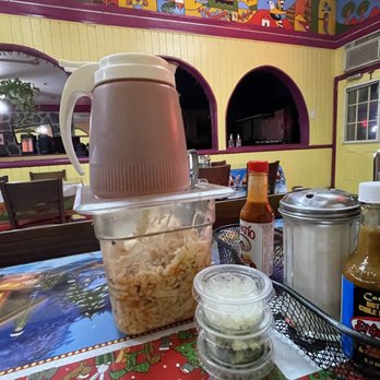 El Buen Sabor - a table with food and condiments - Salvadoran Near Me - Los Angeles, California