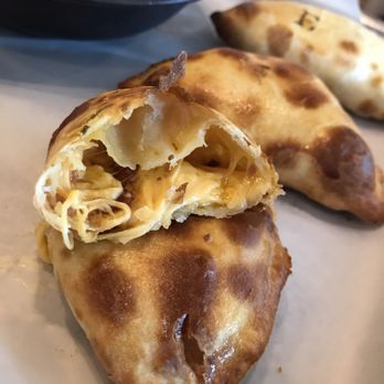 La Masa Empanada Bar - Cheese curd and bacon empanada - the clock shadow curds are killer; if you get this, have it first before the curds cool. - Empanadas Near Me - Milwaukee, Wisconsin