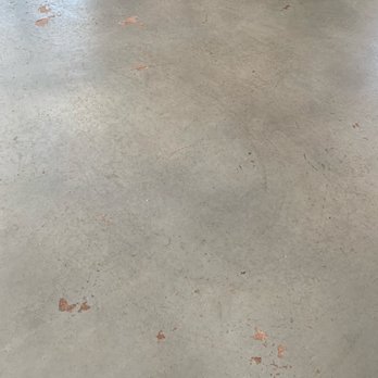 Denver Floor Fx - a concrete floor in a warehouse - Flooring Near Me