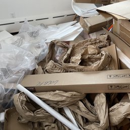One corner of a room full of moving junk that JUNK Relief hauled away in less than 10 minutes.