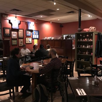 Za - people sitting at tables in a restaurant - Pizza Near Me - Arlington, Massachusetts