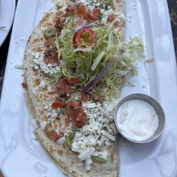 Refinery Rooftop - Chicken Quesadilla with a side of sour cream - Lounges Near Me - New York, New York Refinery Rooftop - Chicken Quesadilla with a side of sour cream - Lounges Near Me - New York, New York