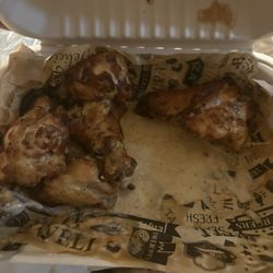 Dough Bowl Pizza - Lemon pepper wings. We hard already started to grub!