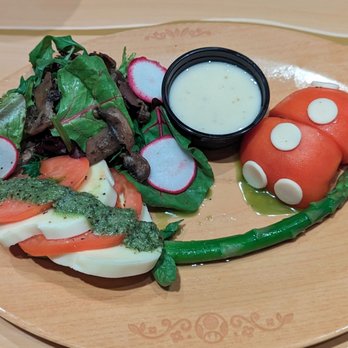 Toadstool Cafe - Caprese Salad. Cheese tasted like a giant cheese stick, pesto was very strong. - Cafes Near Me - Universal City, California Toadstool Cafe - Caprese Salad. Cheese tasted like a giant cheese stick, pesto was very strong. - Cafes Near Me - Universal City, California
