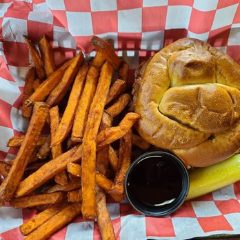 Barnsider Barbeque Restaurant - Pulled pork on a pretzel bun w/ sweet potato fries. - Barbeque Near Me - Lake George, New York
