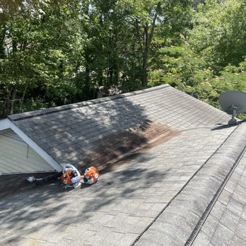 PNW Roots Landscaping - two workers on a roof - Landscaping Near Me PNW Roots Landscaping - two workers on a roof - Landscaping Near Me