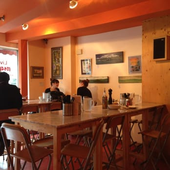 Pizza St-Viateur - people sitting at tables in a restaurant - Pizza Near Me - Montreal, Quebec Pizza St-Viateur - people sitting at tables in a restaurant - Pizza Near Me - Montreal, Quebec