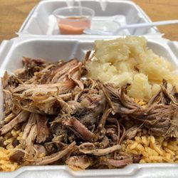 El Coqui - Pernil (pork), yuca (like a dense potato), puerto rican rice with gandules (like a bean). Eat it.