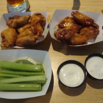 Buffalo Wild Wings - Two flavors of wings, a dry rub on the left and a sauce on the right. - American Near Me - Coon Rapids, Minnesota Buffalo Wild Wings - Two flavors of wings, a dry rub on the left and a sauce on the right. - American Near Me - Coon Rapids, Minnesota