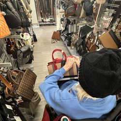 Burlington - Mom checking out a purse