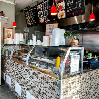 100 Percent Korean - a restaurant counter with a variety of food items - Korean Near Me - Toronto, Ontario