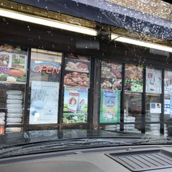 Golden Lake Market - Front windows of the store. If passing at night Silver grates Cover the windows