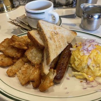 Grand Bazaar NYC - Scrambled eggs with red onions sprinkled on top because the chef fulfilled my request, sausage, toast, and these amazing hashbrowns. - Flea Markets Near Me - New York, New York