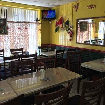 Caribbean Crown - Every West Indian Resturant has a tv with soccer, music videos or Island News playing  #Truth #WhatGoingOnBackHome - Caribbean Near Me - Tampa, Florida