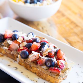 Aubergine Kitchen - a plate of french toast with berries and almonds - Salad Near Me - St. George, Utah Aubergine Kitchen - a plate of french toast with berries and almonds - Salad Near Me - St. George, Utah