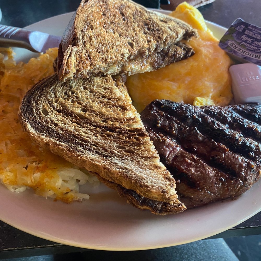 grilled steak, hash browns, and hash browns