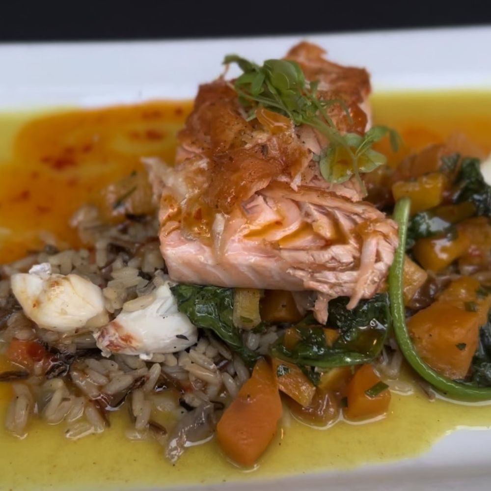 The Belvedere Inn - PAN SEARED SALMON (GF) wild rice with lump crab, roasted butternut squash with poached raisin, spinach, spicy coconut curry, and chili oil - New American Near Me - Lancaster, Pennsylvania