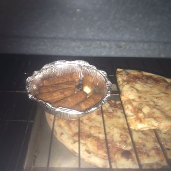 Frank's Pizzeria - a pan of food cooking in an oven - Pizza Near Me - Warwick, New York