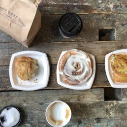 Croissant, cinnamon roll, exploding bread, cappuccino
