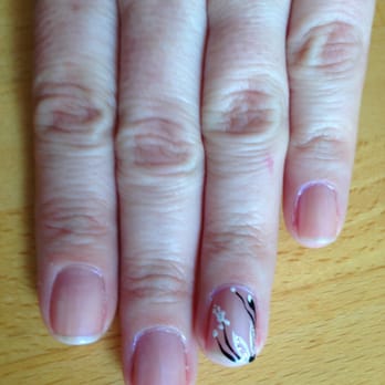 Sassy Nails and Tanning - Light pink polish, with a white, silver, black floral design on the ring fingers.  Will match my dress perfectly! - Nail Salons Near Me - Ellsworth, Maine