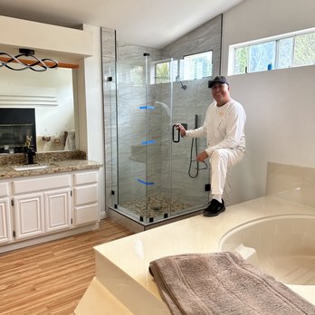 Expert Renovations and Repairs - a man in a bathroom - Flooring Near Me - Fullerton, California Expert Renovations and Repairs - a man in a bathroom - Flooring Near Me - Fullerton, California