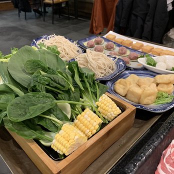 Happy Lamb Hot Pot - Veggie combo, two orders of thick cut noodles, fish tofu, fried tofu, lamb meatballs, and quail eggs - Hot Pot Near Me - Boston, Massachusetts Happy Lamb Hot Pot - Veggie combo, two orders of thick cut noodles, fish tofu, fried tofu, lamb meatballs, and quail eggs - Hot Pot Near Me - Boston, Massachusetts