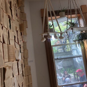 FIKA - Book wall room looking out towards the back patio and hammock - Coffee & Tea Near Me - Toronto, Ontario