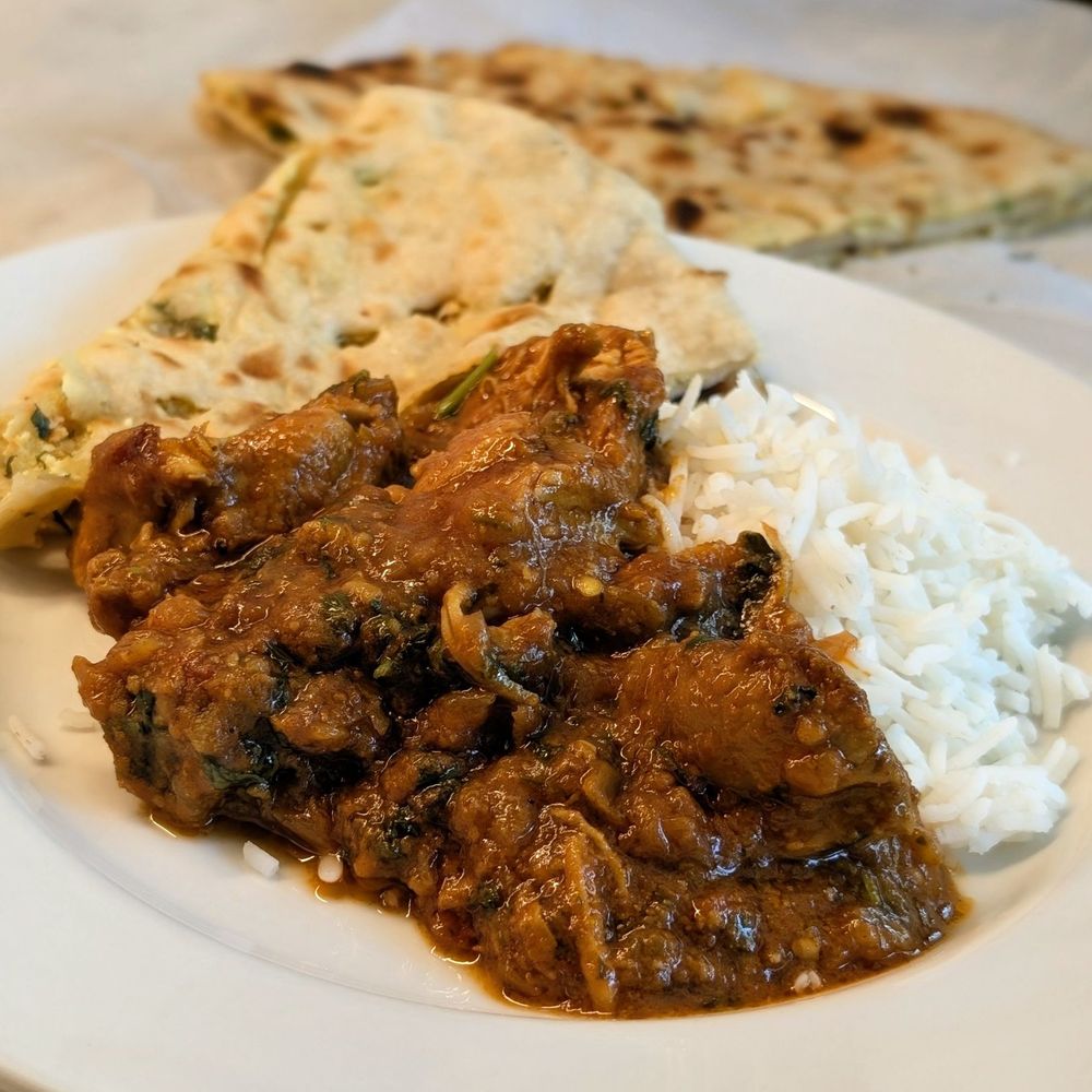 Curry Court - Curry chicken with paneer stuffed Kulcha naan. Another delicious plate of food (takeout) - Indian Near Me - Monroe, North Carolina Curry Court - Curry chicken with paneer stuffed Kulcha naan. Another delicious plate of food (takeout) - Indian Near Me - Monroe, North Carolina