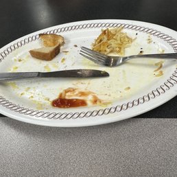 a half eaten plate of food a half eaten plate of food
