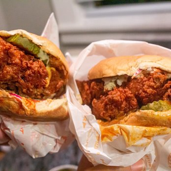 Haven Hot Chicken - two hands holding sandwiches - Chicken Shop Near Me - New Haven, Connecticut Haven Hot Chicken - two hands holding sandwiches - Chicken Shop Near Me - New Haven, Connecticut