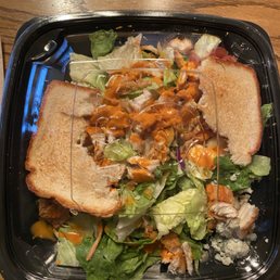 I just went through the drive through and this is how my salad looked when I got home. Looks like someone else has been eating it.