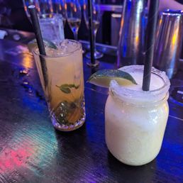 two cocktails on a bar two cocktails on a bar