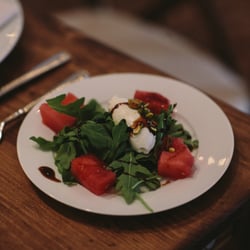 Watermelon salad, arugula, harley farms goat cheese, pistachio nut crust, fig balsamic glaze