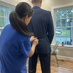 My husband getting his suit tailored by Kim! Always great service.