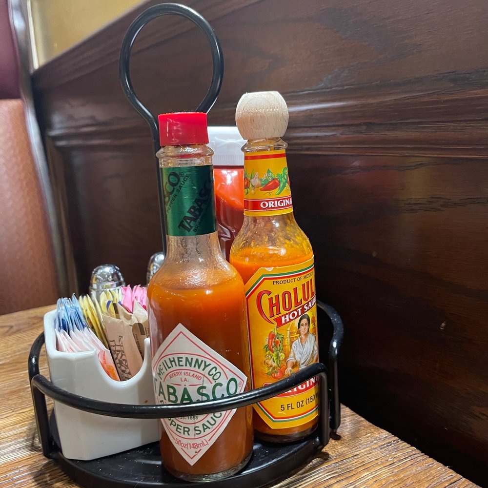 Grand Canyon Restaurant - a tray of hot sauces and condiments - American Near Me - Brooklyn, New York Grand Canyon Restaurant - a tray of hot sauces and condiments - American Near Me - Brooklyn, New York