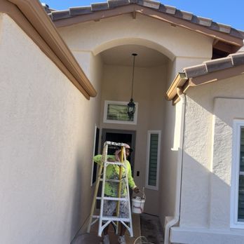 Authentic Painting - Exterior paining, done almond for stucco Roman brick for eaves fascia - Painters Near Me
