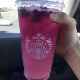 a pink drink in a plastic cup a pink drink in a plastic cup