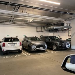 Parking lot on the ground level right by the entrance. Taken by non electric cars. Parking lot on the ground level right by the entrance. Taken by non electric cars.