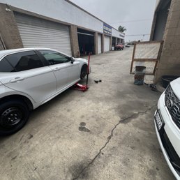 Car waiting on tires to be patched
