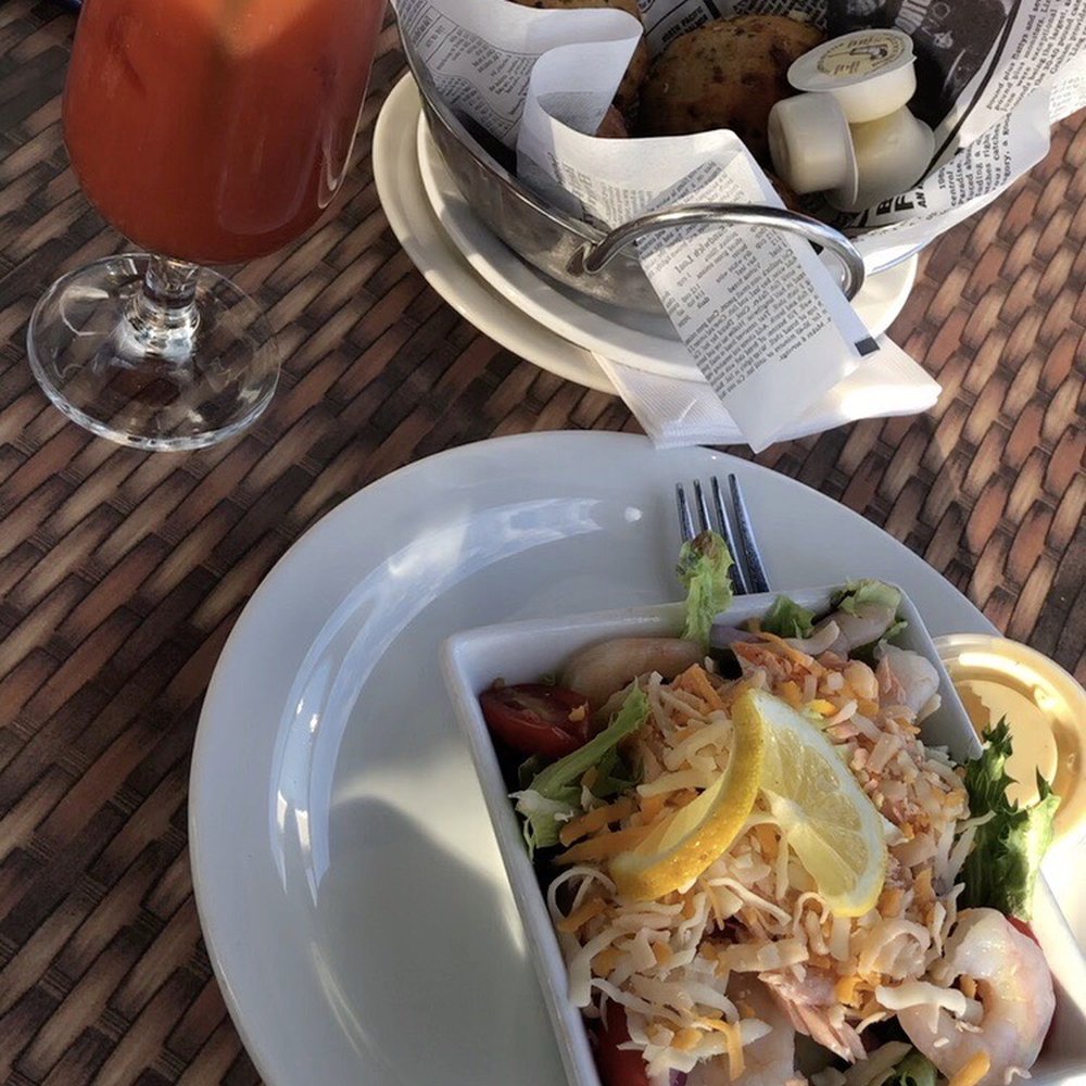 The Boathouse - This is the Boathouse small salad with salmon and shrimp, cheese and honey dijon dressing. The herb biscuits and Caesar are great too. - Seafood Near Me - Belleville, Ontario