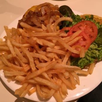 Rae and Jerry's Steak House - Cheeseburger covered in a plate of fries! - Steakhouses Near Me - Winnipeg, Manitoba