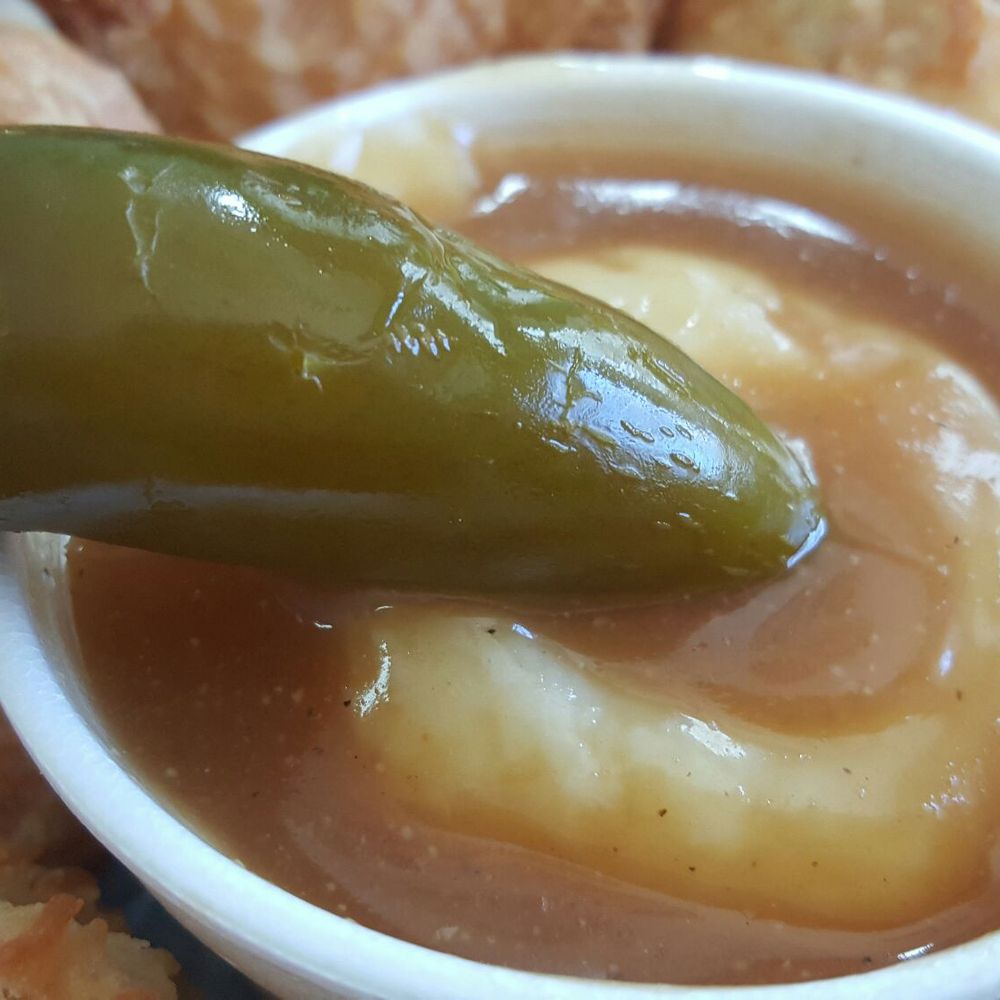 Church's Texas Chicken - $0.65 1 pc pickled jalapeño, and the mashed potatoes gravy that came with my $2.99 2 pcs dark chicken meal - Chicken Wings Near Me - Chamblee, Georgia