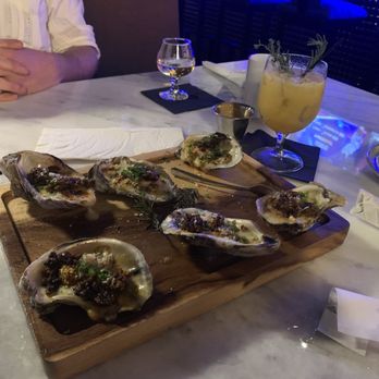 Aguasanta - Grilled oysters with chorizo - Diners Near Me - New Orleans, Louisiana Aguasanta - Grilled oysters with chorizo - Diners Near Me - New Orleans, Louisiana