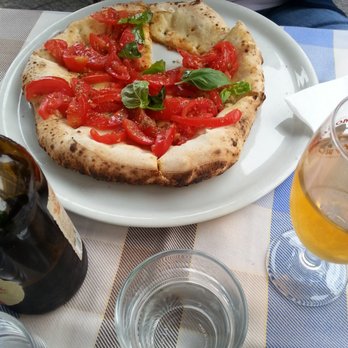 Trattoria Medina - tomatoes on pizza dough with basil - Italian Near Me - Naples, NA Trattoria Medina - tomatoes on pizza dough with basil - Italian Near Me - Naples, NA