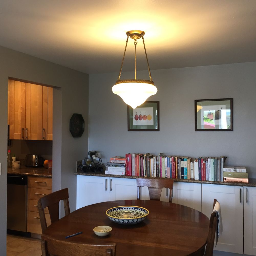 Small dining room with a perfect fixture from Omega!